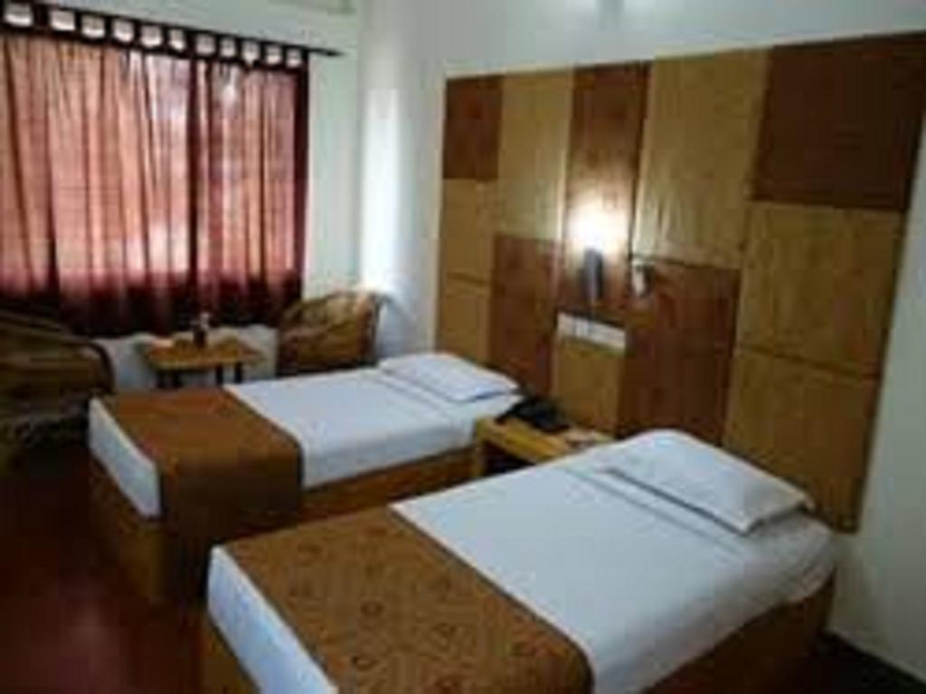 Dejavu Hotel Kojambuttúr Szoba fotó