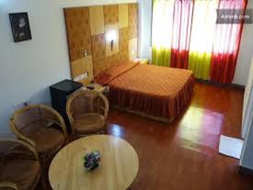Dejavu Hotel Kojambuttúr Szoba fotó